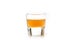 Small Shot Glass of organic Apple Cider Vinegar with the mother, raw and unpasteurized Apple Cider Vinegar on white background