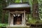 A small shrine beside a Yorishiro tree at Kawaguchi Asama Shinto Shrine, Fujikawaguchiko, Japan