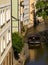 Small sightseeing boat driving through Certovka canal in Prague