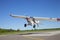 Small single engine airplane takes off from a municipal airfield in rural Minnesota