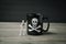 Small Skeleton Standing Beside Coffee Mug