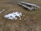 small snow patch and empty wooden park benches in the beginning of spring hight in the arctic circle