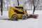 A small snowplow for snow removal in the city. Russia
