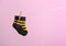 Small socks hanging on washing line against color background. Baby accessories