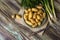 Small sort potatoes, dill, green onionsand and knife close-up