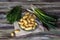 Small sort potatoes, dill, green onionsand and knife close-up