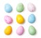 Small speckled multicolored chocolate eggs set on a white background, isolated. Top view