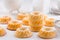 Small sponge cakes with cottage cheese. Ring cakes on white background