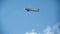 Small sport airplane flying in the background of blue sky, view from below, clear blue sky in background