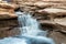 Small springtime waterfall in desert mountains