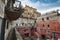 A small square in the old village of San Felice Circeo Latina, Italy, view from a raised walkway. Coloured houses. Local