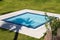 Small square pool with shadow of a palm tree on the island of Te