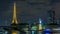 The small Statue of Liberty located near the Eiffel tower night timelapse. Paris, France