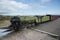 A small steam locomotive on narrow gauge track