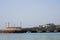 Small stone Barna pier, county Galway, Ireland. Blue ocean and sky. Popular travel area. Irish landscape. Small yachts and fishing