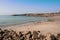 Small stone Barna pier, county Galway, Ireland. Blue ocean and sky. Popular travel area. Irish landscape. Small yachts and fishing