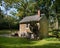 A small stone cottage in a summer forest in eastern Pennsylvania