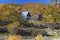 Small stone house and haystack autumn forest in the mountains