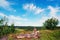 A small stone pyramid on the cliff . Summer landscape, Karelia.