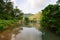 Small storage pond with a concrete and steel bridge