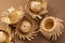 Small straw hats used for festa junina ornaments on brown background