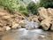 A small stream coming out from a couple of rocks