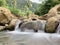 A small stream coming out from a couple of rocks in Kanyakumari India