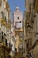 Small street in Cadiz with tradtitional houses and moorish style tower