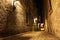 Small street and historical buildings in the historic site of Old Port from Montreal, night view. Scenic background of Canadian