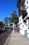 A small street with residential buildings near a large highway with exits in the Central district of Los Angeles.