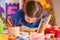 Small students children painting in art school class.