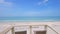 Small summer balcony with two chairs revealing magnificent ocean view with turquoise blue water in Nokomis, Florida