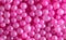 Small sweet pink balloons as a background.