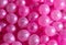 Small sweet pink balloons as a background.