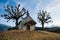 Small Swiss Chapel in Winter with Mountains in the Background