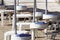 Small tables of a beach umbrella without people