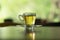 small teacup with tea placed on saucer. blur background. this image for drink,food,beverage concept