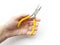 Small thin-nose pliers with bright yellow handles in the left hand  object on a white background