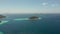 Small torpic island with a white sandy beach, top view.