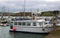 The small tourist cruiser The Spirit of Kinsale tied up in the harbor at Kinsale in County Cork on the south coast of Ireland.