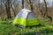Small touristic tent stay on forest glade with flowers
