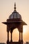 Small tower of Jama Masjid mosque in the center of Delhi during sunset, Indi