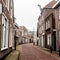 Small town Den Hoorn on the Texel island. Empty street in foggy morning. The Netherlands, Europe