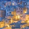 Small town in the evening illumination, vintage houses pattern background