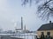 Small town landscape with smoking chimney on background.