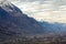 Small town in valley at the foot of magnificent Alps mountain, Switzerland. Quiet life on background of fantastic peaks covered wi