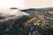 Small town village during the sunrise with fog. surrounded by hills in lower austria. Aerial drone photo