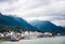 Small town at Yangtze river`s edge with mountain and cloud background