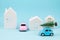 Small toy car carring christmas tree over the roof. Sesonal holidays, greeting card