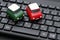 Small toy car on computer keyboard